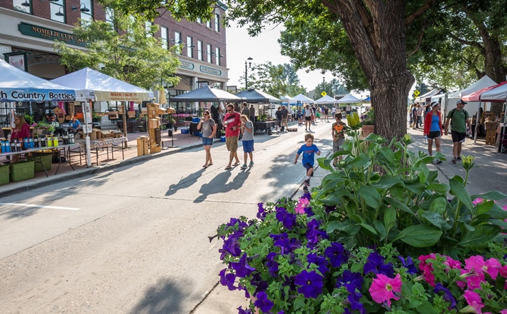 People walking down business district in Parker in the Spring | Thomas Sattler Homes